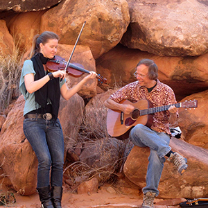 Karina Wilson and Larry Unger playing in a canyon